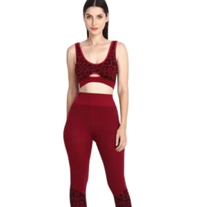 Matching red sports bra and high waist leggings ith red white sneakers.