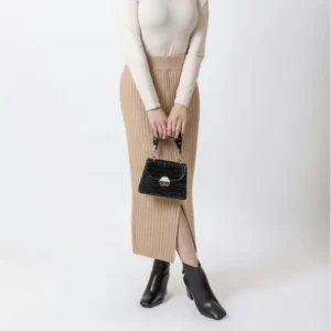 beige knitted skirt with black boots