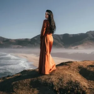 orange flowy gown on mountain view